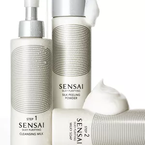Silky Purifying cleansing product bottles shown together with their texture 
